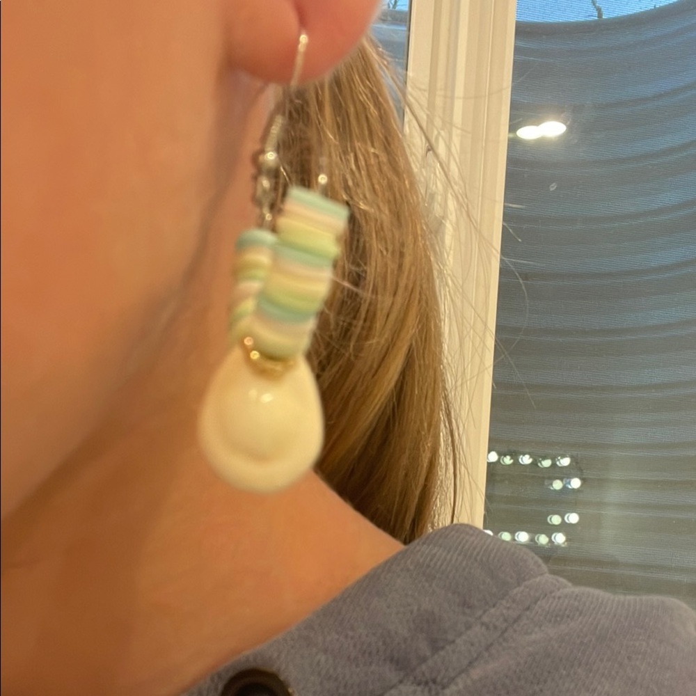 Cute multicolor beaded earrings with gold accents and a shell charm